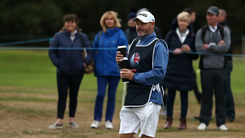 Lee Westwood’s caddie Bill Foster  comes backs with hot drinks during day two of the British Masters at Walton Heath Golf Club in Surrey. Photograph:  Steven Paston/PA Wire
