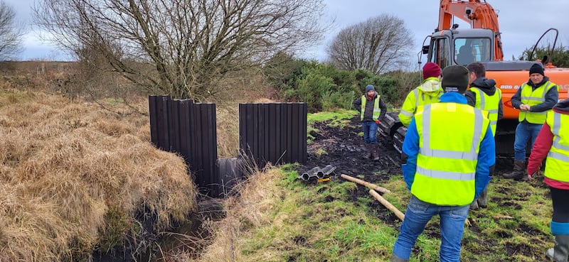 A plastic dam being installed on farm as part of a FarmPeat EIP rewetting project near Athlone in Co Westmeath. Photograph: FarmPEAT EIP