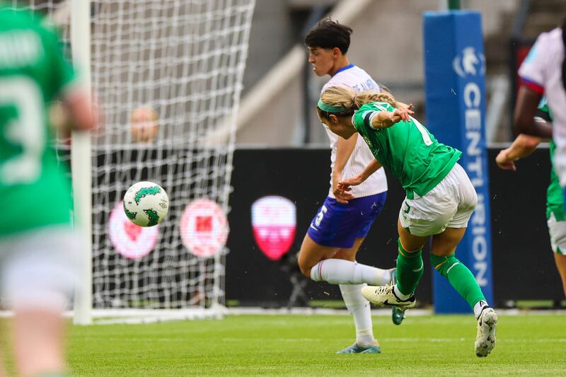 Ireland's Julie-Ann Russell scores against France. Photograph: James Crombie/Inpho