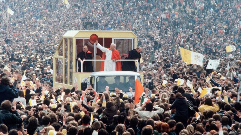 The pope in Ireland: John Paul II waves to crowds in 1979. Photograph: Anwar Hussein/Getty