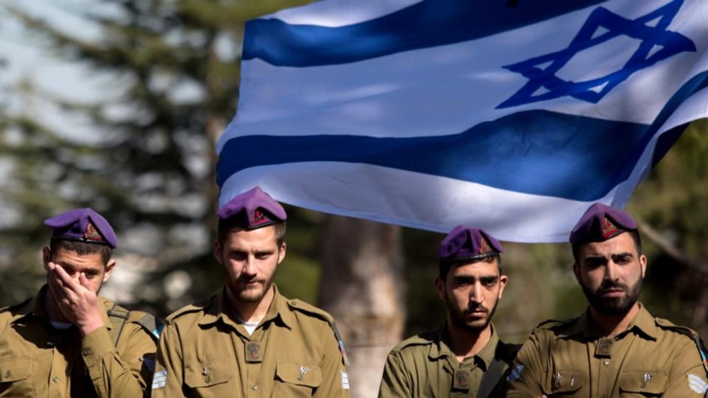 Israeli soldiers mourn during the funeral of a colleague killed in a clash on the Lebanese border at Mount Hertzel cemetery in Jerusalem. Photograph: Abir Sultan/EPA.