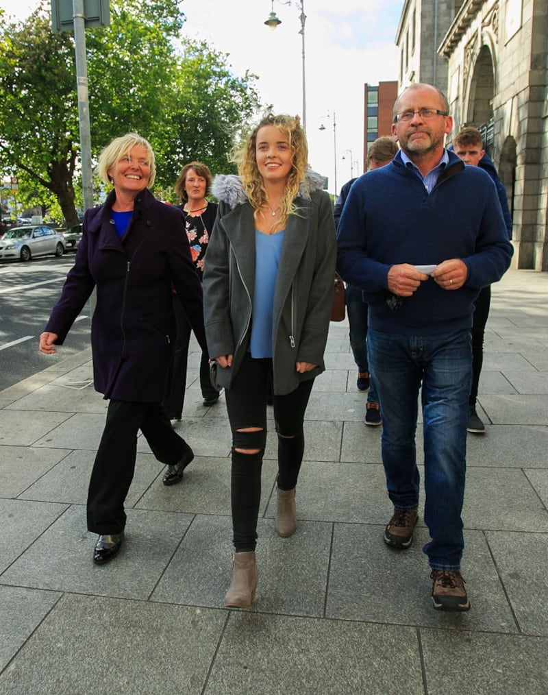 Rebecca Carter with her parents Annemaire and Niall leave the High Court in Dublin Photograph: Gareth Chaney/Collins