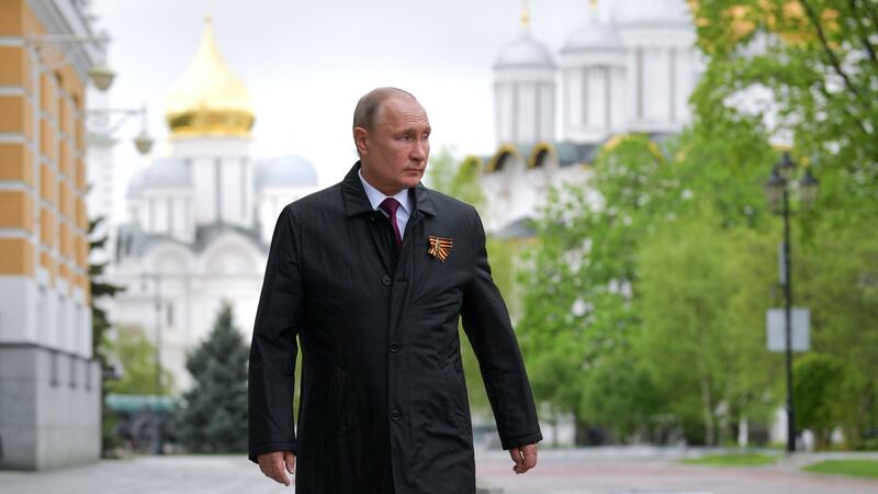 Russian president Vladimir Putin walk after watching the Victory Day air parade over the Red Square in Moscow. Photograph: Alexei Druzhinin/Sputnik/Kremlin