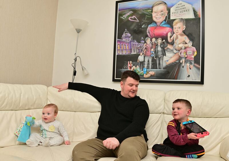 Dáithí with his father Máirtín and little brother Cairbre. Photograph: Colm Lenaghan/Pacemaker for The Irish Times