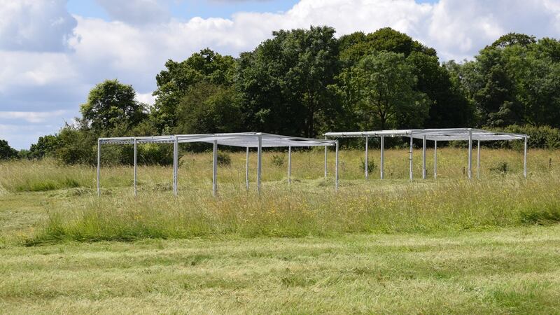 Drought-simulating equipment on calcareous grassland within Wytham Woods, part of the RainDrop experiment studying the impact of climate change on this ecosystem. Photograph: courtesy of University of Oxford