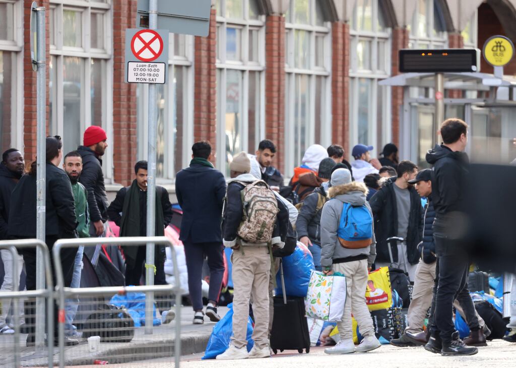 Gathering belongings during a multi-agency operation to move asylum seekers from tents in Mount Street in Dublin earlier this week. Photograph: Dara Mac Dónaill/The Irish Times