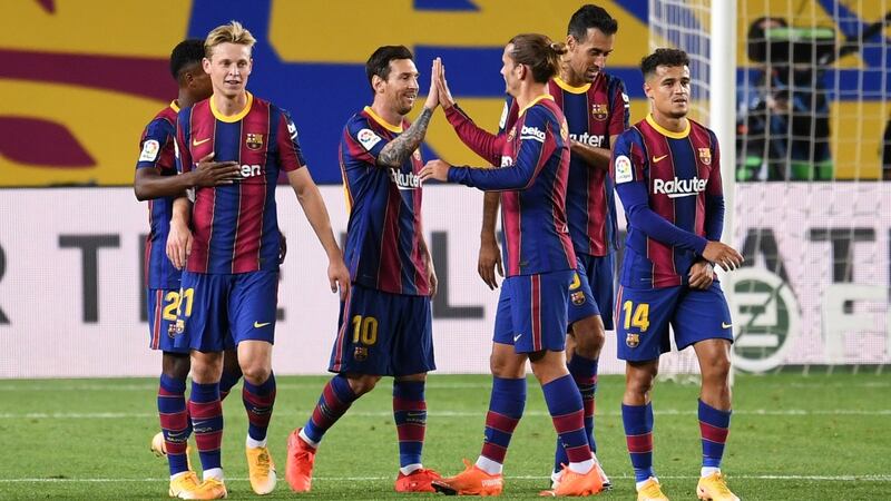 Lionel Messi and Antoine Griezmann celebrate Barcelona’s fourth against Villarreal at Camp Nou in Catalonia. Photograph: Getty Images