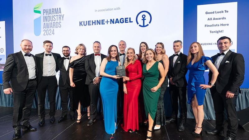 Eve Coleman, business development lead at Unispace Life Sciences, presents the pharma project of the year - large to the Pfizer team