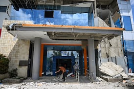 Rescue teams search for survivors in Indonesia after powerful earthquake