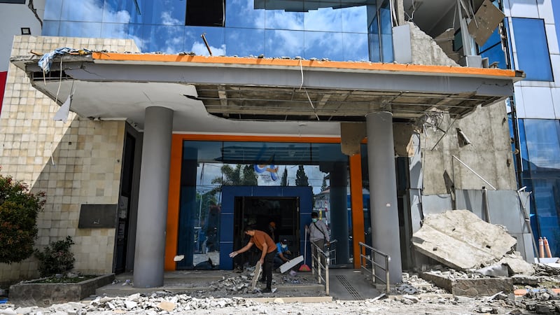 Rescue teams search for survivors in Indonesia after powerful earthquake