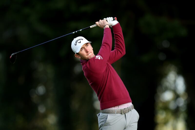 Tom McKibbin of Northern Ireland plays his second shot on the 10th hole. Photograph: Jasper Wax/Getty