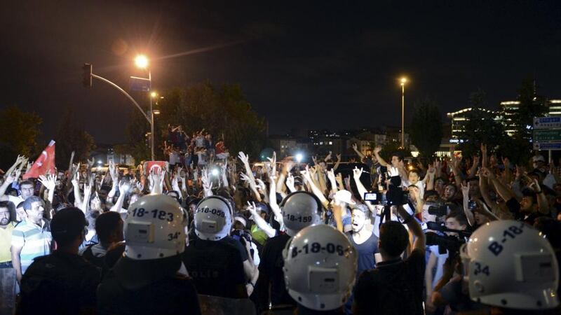 Demonstrators shout nationalist slogans during a protest in front of the headquarters of the Hurriyet  building. Photograph: Levent Kulu/Hurriyet Daily
