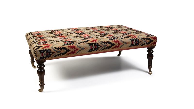 Lot 219: a late Georgian mahogany and needlework footstool on its obliging brass castors (€300-€400).