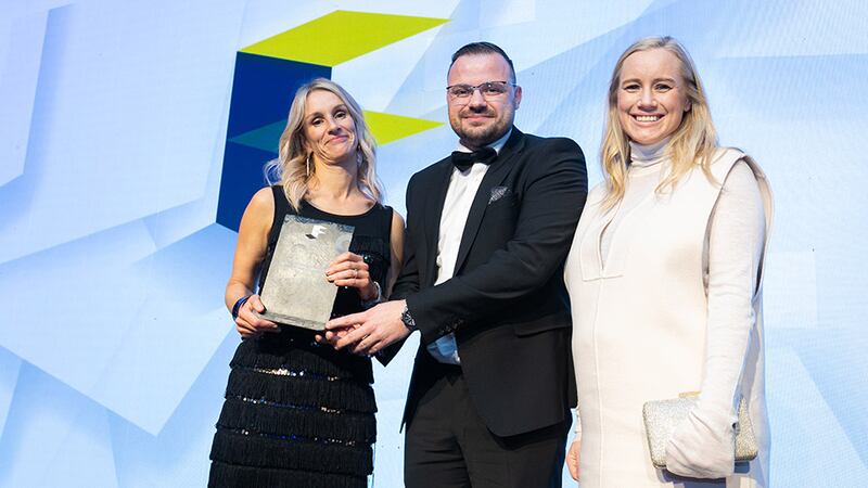 Gareth Heaney, contracts director, Johnston Fitout, presents the Fit Out Project of the Year - Tourism and  Leisure award to Catherine Crowe and Lucy Rainey, Luca Architecture.