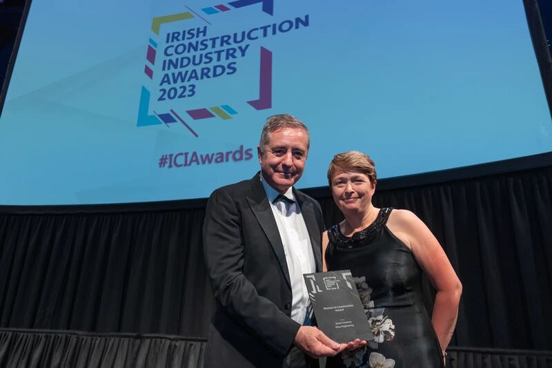 Ken Green, business development director, Alucraft, presents the women in construction award to Susan Cormican, Ethos Engineering