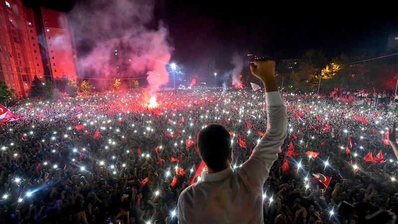 Republican People’s Party (CHP) candidate for mayor of Istanbul Ekrem Imamoglu celebrating in front of supporters at Beylikduzu in the city after his decisive win in Sunday’s election. Photograph: CHP press service/AFP/Getty Images