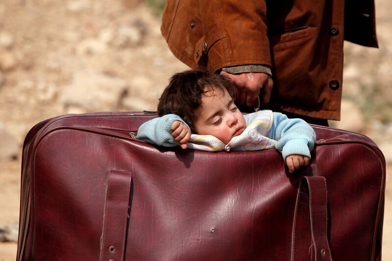 Stories of 2018: this photograph, taken in Syria, makes us wonder how far the child has travelled. Photograph: Omar Sanadiki/Reuters