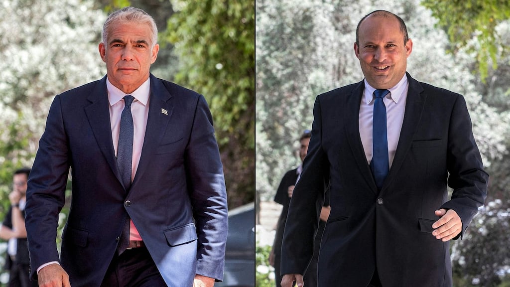 The leader of Israel’s Yesh Atid  party Yair Lapid, and leader of the Yamina party Naftali Bennett, arriving at the Israeli President’s residence in Jerusalem. Photographs: Oren Ben Hakoon/ AFP via Getty Images