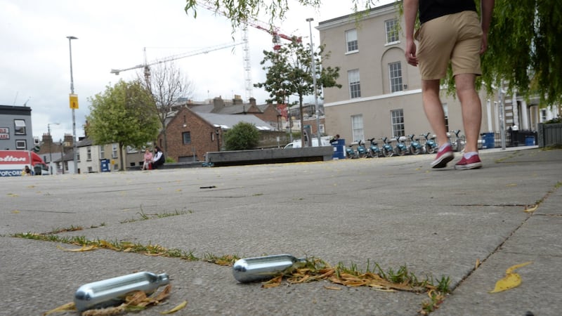 Small gas cylinders (nitrous oxide) on the ground at the Square in Portobello, Dublin. Photograph: Dara Mac Dónaill