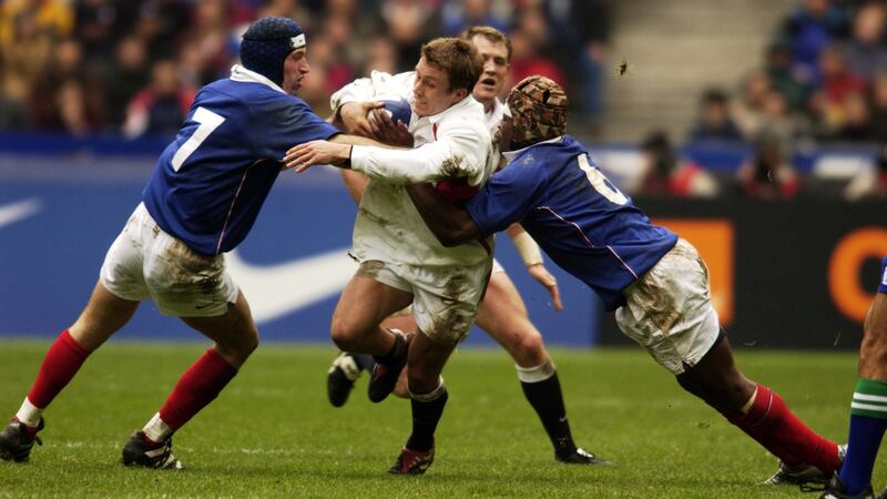 England’s Jonny Wilkinson  is tackled by Olivier Magne  and Serge Betsen of France in the 2002 Six Nations. Photograph: Dave Rogers/Getty Images