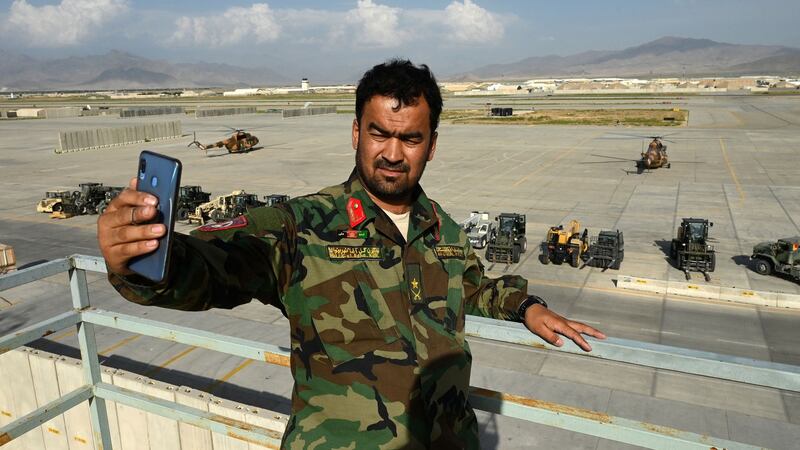 An Afghan National Army  soldier in Bagram Airfield four days after it was abandoned by US troops on July 1st. Photograph: Wakil Kohsar/AFP via Getty Images