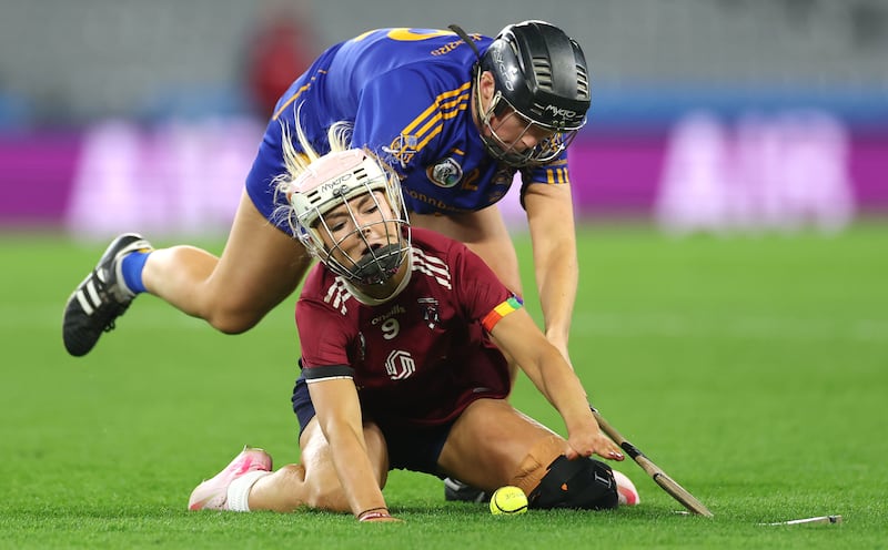 Keeva McCarthy of St Finbarr's and Olwen Rabbitte of Athenry. Rabbitte was back in action despite recent surgery for a cruciate ligament injury. Photograph: James Crombie/Inpho