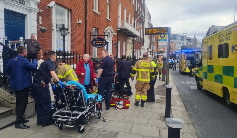 Members of the Dublin Fire Brigade and other emergency services on the scene. Photograph: Kitty Holland / The Irish Times
