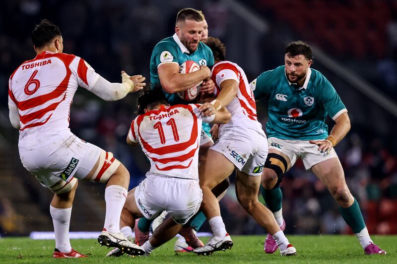 Ireland's Stuart McCloskey is tackled by Japan's Taira Main. Photograph: Ben Brady/Inpho