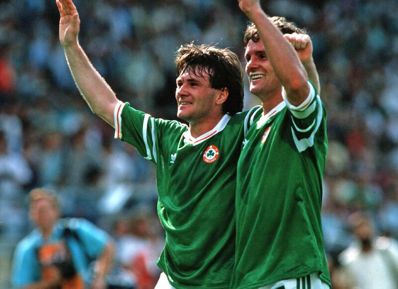 A day like no other: Ray Houghton and Kevin Moran celebrate Ireland's stunning win over England in Stuttgart at Euro 88. Photograph: Billy Stickland/INPHO