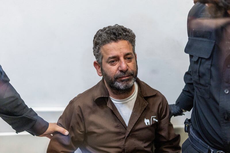 Israeli officers bring Spanish activist Saif Abu Keshek to a court in Ashkelon on Tuesday. Photograph: ilia Yeftimovich/AFP via Getty Images