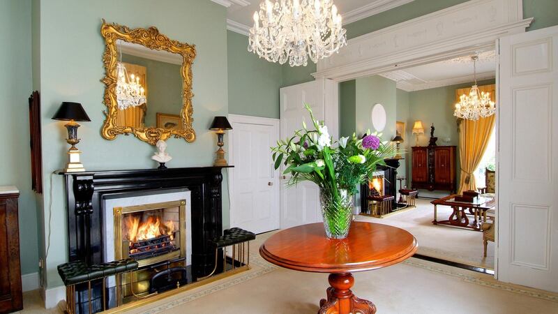 The interconnecting drawing and diningrooms on the upper floor have very impressive ceiling roses and original fireplaces
