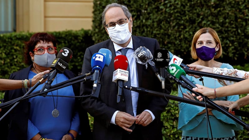 Former Catalan regional president Quim Torra (centre) delivers a press conference after his meeting with former Catalonia’s parliament president Carme Forcadell (right) and former Catalan regional minister Dolors Bassa (left) in Barcelona on Tuesday. Photograph:  Toni Albir/EPA