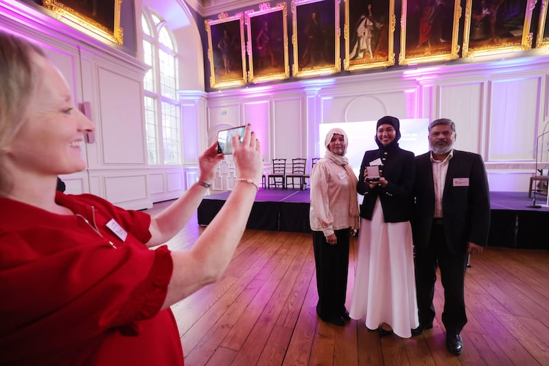 Gaisce gold medal recipient Dr Nazia Rafiq, a former pupil of St Joseph’s College, with her parents Abdul Rafiq and Fozia Rafiq after the ceremony. Photograph: Alan Betson

