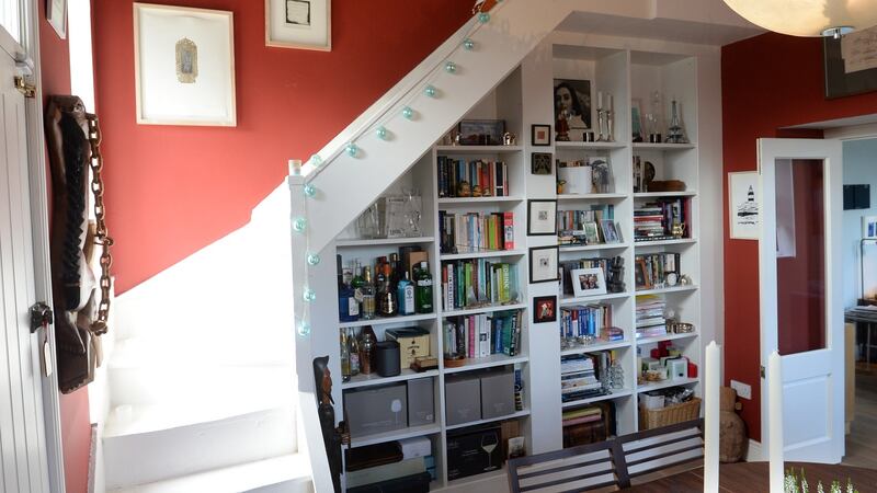 Dining room with stairs – ‘going nowhere’ – that had to be kept for planning purposes in Gregory Curran’s home in Ringsend. Photograph: Dara Mac Dónaill