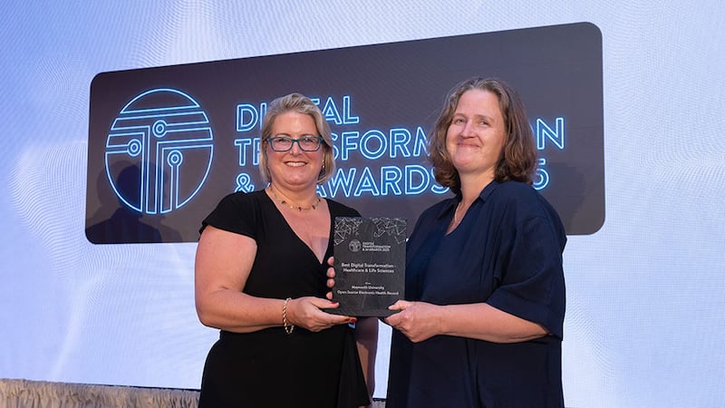 Maria Svejdar, award judging coordinator, presents the best digital transformation - healthcare & life sciences to Maxine Radcliffe, Maynooth University
