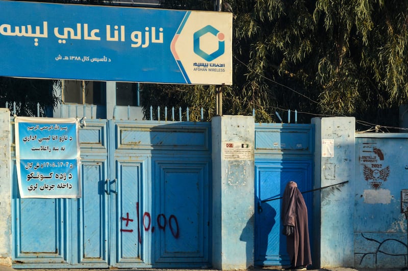 A woman waits to enter a school in Kandahar on December 1st. Photograph: Sanaullah Seiam/AFP via Getty Images
