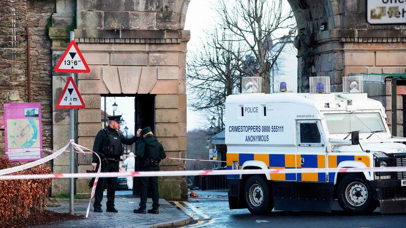 Poice Officers and police forensic officers work at the scene in the aftermath of a suspected car bomb explosion in Derry. Photograph:  Paul Faith/AFP/Getty Images