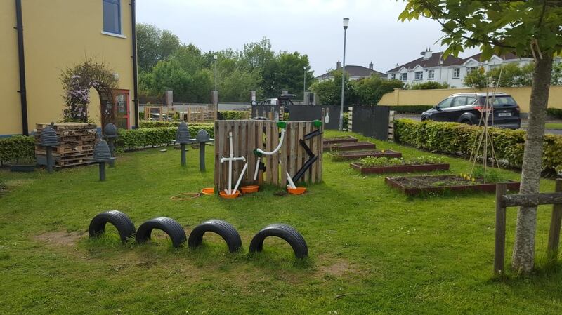 Tyres, raised beds and chalk boards featre in  the outdoor learning space at Knocknacarra National School in Galway.