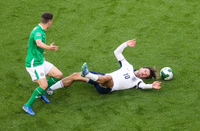 Jack Grealish goes to the ground near Ireland's Séamus Coleman. Photograph: Bryan Keane/Inpho