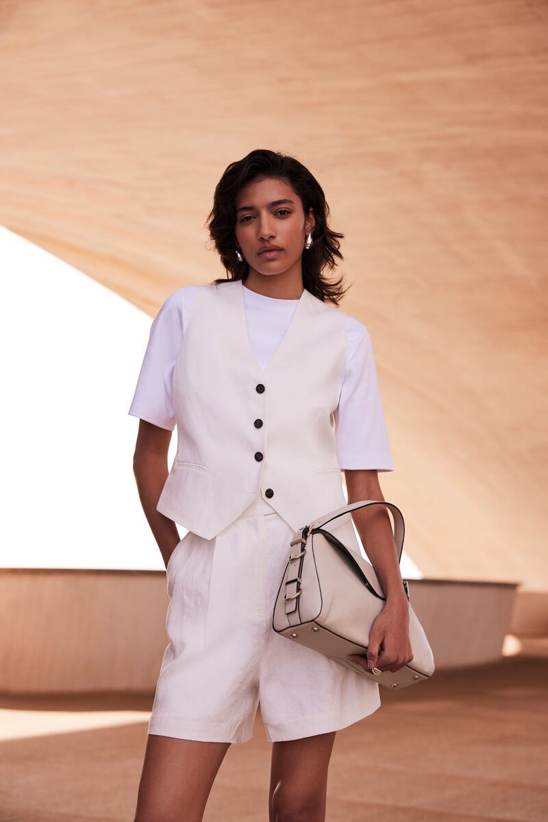 White linen tailored waistcoat, €129; white linen tailored shorts, €99; both at Mint Velvet