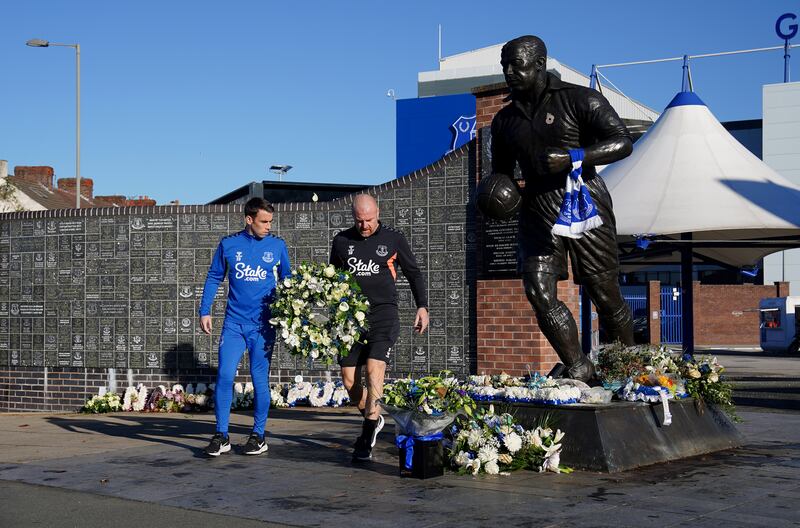 Everton captain Seamus Coleman and manager Sean Dyche lay flowers by the Dixie Dean statue outside Goodison Park in tribute to former Everton chairman Bill Kenwright following his death in October. Photograph: Peter Byrne/PA Wire
