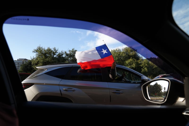 A supporter of Jose Antonio Kast celebrates upon hearing the first results of the presidential runoff in Santiago, Chile. Photograph: EPA