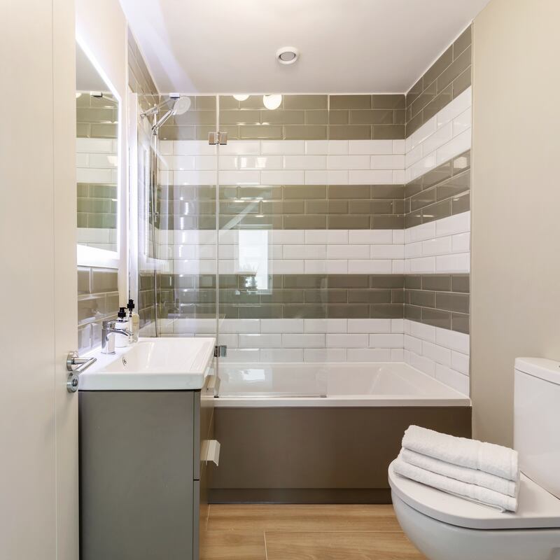 There is high-quality dual-colour subway-style tiling in the bathrooms and en suites.