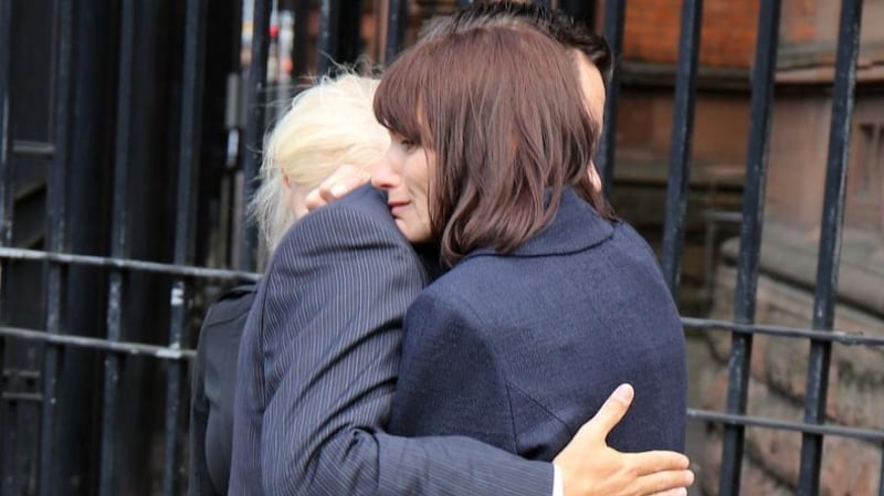 Karen Robinson Walton is comforted after speaking to the media following the inquest into the death of her son Benjamin. Photograph: Paul Faith/PA Wire