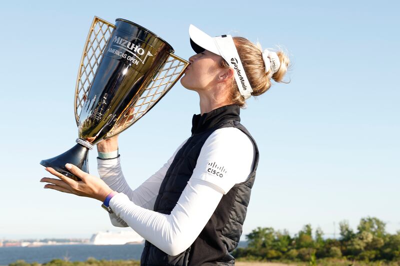 Nelly Korda of the United States poses with the winner’s trophy after winning the Mizuho Americas Open. Photograph: Sarah Stier/Getty