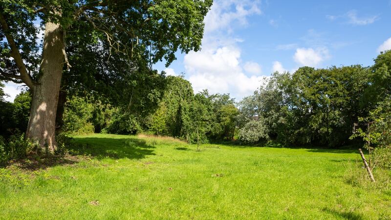 The property includes  6.3 acres of lawns
