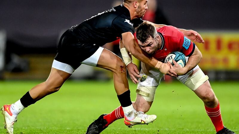 Munster’s Fineen Wycherley is tackled by Rhys Webb of  Ospreys during the United  Rugby Championship match at the  Liberty Stadium in  Swansea. Photograph: Ashley Crowden/Inpho