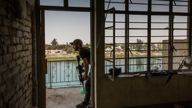 An Iraqi special forces soldier keeps watch from a position near a bank of the river Tigris in the Old City of Mosul, Iraq, on July 15th. Photograph: Ivor Prickett/The New York Times