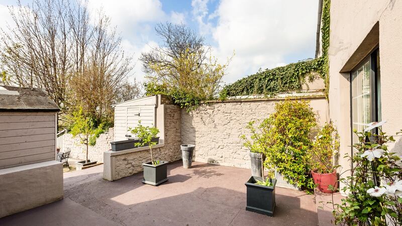 The garden is set out over three  stepped levels with room to extend the house