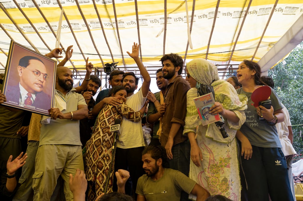 Abhijeet Dipke (centre) and other leaders of the Cockroach Janta Party (CJP), one holding an image of non-violent protest icon B.R. Ambedkar, celebrate the resignation of education minister Dharmendra Pradhan at the movement's demonstration site in New Delhi on July 25th, 2026. Photograph: Saumya Khandelwal/The New York Times.
